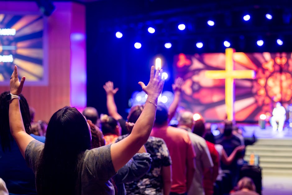 Christian community gathered in joyful Apostolic Pentecostal worship with diverse families and Spirit-filled praise